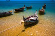 Long Tail Boats on cristal clear sea