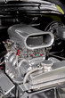 supercharger under the hood of a performance car