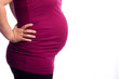 Young pregnant Caucasian woman holding her painful back