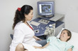 Doctor scanning of a stomach of pregnant woman