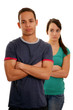 Foto: Unhappy teenage couple over white background Unhappy teenage couple over white background