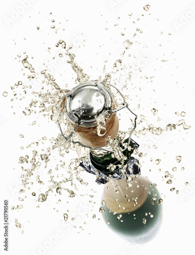 Photo: Cork flying out of a sparkling wine bottle Cork flying out of a sparkling wine bottle