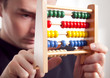 Photo: concentrated businessman with abacus concentrated businessman with abacus