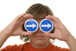Teenager holds before eyes signs with arrows