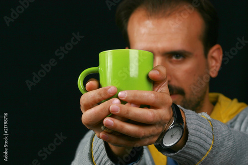Photo: charismatic man drinking tea charismatic man drinking tea