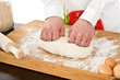 Male chef kneading dough for baking. Male chef kneading dough for baking.