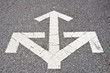 Three way arrows on asphalt Three way arrows on asphalt