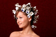 Photo: Young beautiful woman hairstyling with hair rollers Young beautiful woman hairstyling with hair rollers