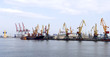 Panorama of the port with cargo cranes and vessel