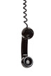 A black telephone receiver on a white background