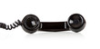 A black telephone receiver on a white background