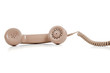 Beige phone receiver on a white background