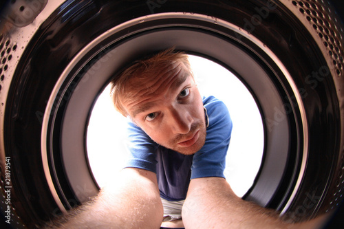 Photo: young man in wash machine young man in wash machine