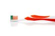 Orange toothbrush on a white background