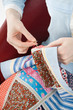 Close-up of woman's hand stitching quilting