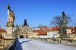 The snowy Prague's gothic Castle with the Charles Bridge The snowy Prague's gothic Castle with the Charles Bridge