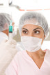 Physician holding a syringe