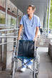 Male nurse with a wheelchair