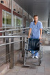 Doctor pushing a wheelchair