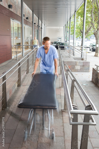 Foto: Male nurse with a stretcher Male nurse with a stretcher