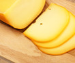 cheese slices on cutting board, top view