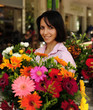 Photo: woman with huge bouquet of flowers outdoors woman with huge bouquet of flowers outdoors