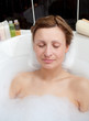 Beautiful woman relaxing in a bubble bath Beautiful woman relaxing in a bubble bath