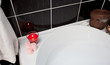Bubble bath with candle and flowers Bubble bath with candle and flowers