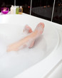 Woman's feet in a bubble bath Woman's feet in a bubble bath
