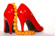 Red shoes and amber collar or chaplet Red shoes and amber collar or chaplet