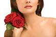 Woman with red roses on neck Woman with red roses on neck
