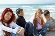 group of young friends on the beach