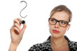 blonde student girl drawing a question mark in the air