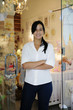 Photo: small business owner: proud woman and her store small business owner: proud woman and her store