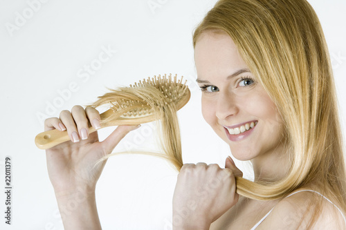 Photo: portrait of combing woman wearing underwear portrait of combing woman wearing underwear