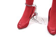 Restraint. Women legs in handcuffs