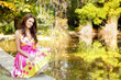 Elegant beautiful woman with colorful dress outdoor