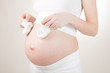 pregnant woman put booties to my stomach