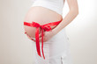 stomachs of pregnant women tied a scarlet ribbon