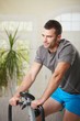 Man training on exercise bike