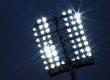 Stadium lights and dark blue sky