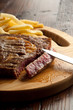 cut porterhouse with french fry and knife cut porterhouse with french fry and knife