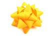 Yellow gift wrapping bow isolated on white background.