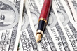 close-up pen on the money