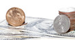 stacks coins over dollars background