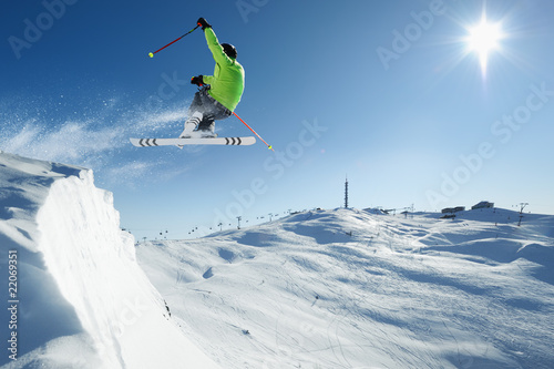 Photo: Jumping Skier in alpine mountains Jumping Skier in alpine mountains