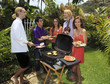friends at a backyard bar-b-que in hawaii friends at a backyard bar-b-que in hawaii