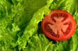Tomato slice over salad