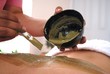 woman in spa with mud on her back