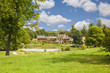 The Hamlet houses behind a lake of Versailles Chateau The Hamlet houses behind a lake of Versailles Chateau
